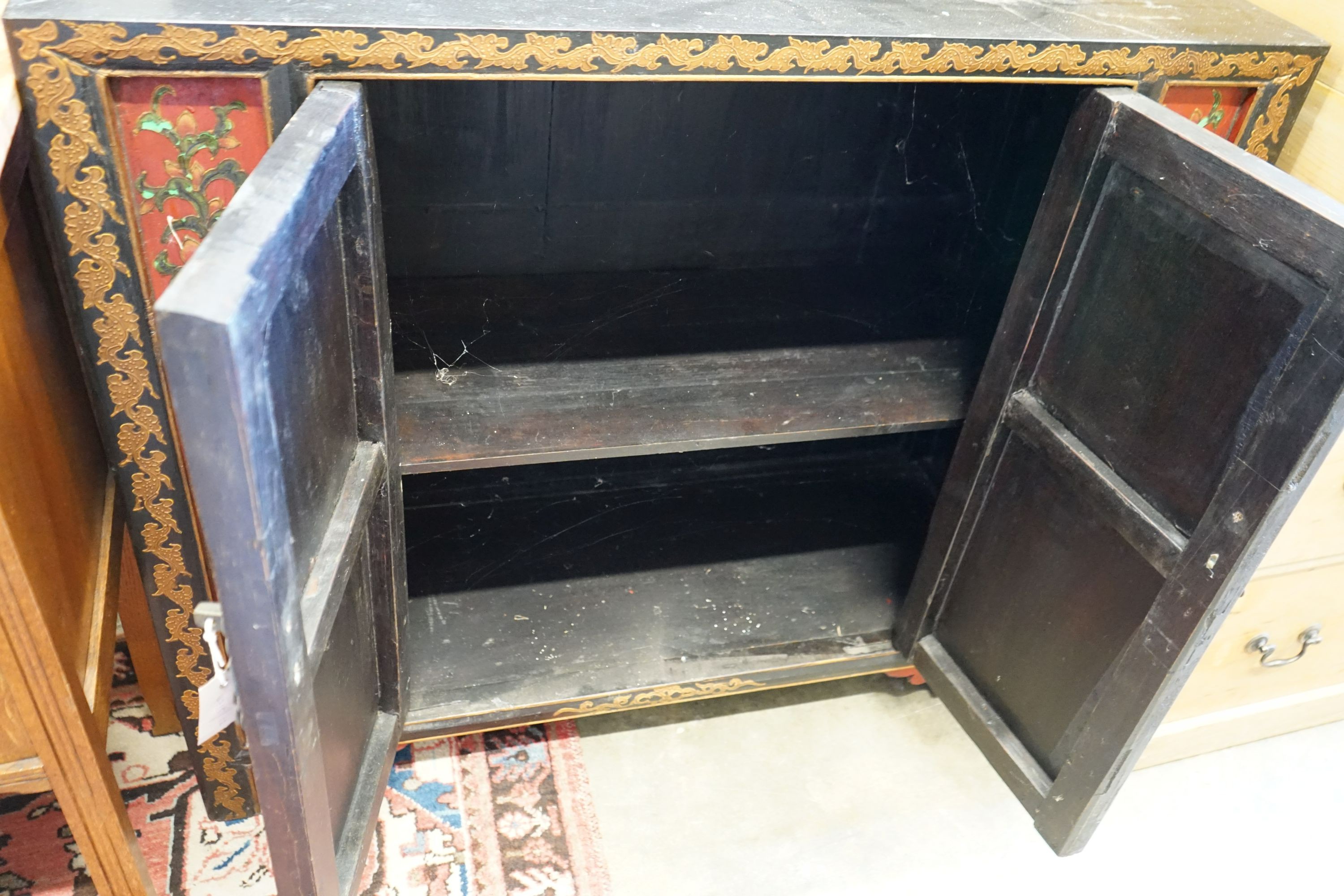 A Chinese lacquer two door side cabinet, width 100cm, depth 38cm, height 86cm